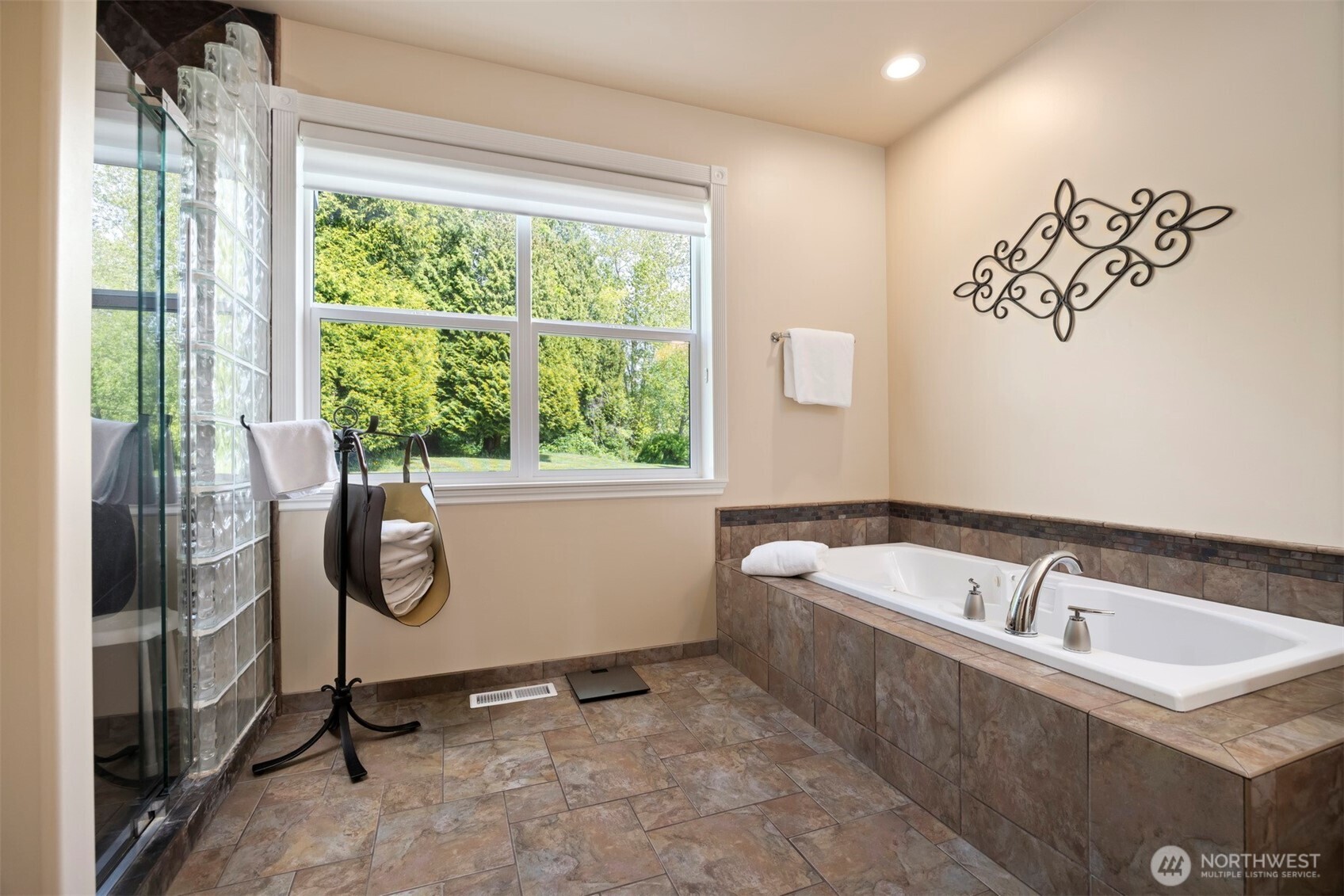 6152 Garrett Lane Ferndale, WA 98248 - Photo 30 of 40 a bathroom with a tub a sink and mirror