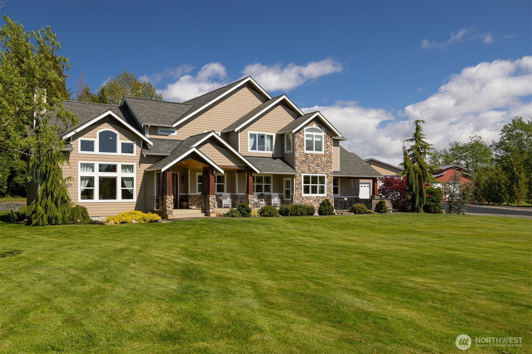 6152 Garrett Lane Ferndale, WA 98248 - Photo 4 of 40 a front view of a house with a garden
