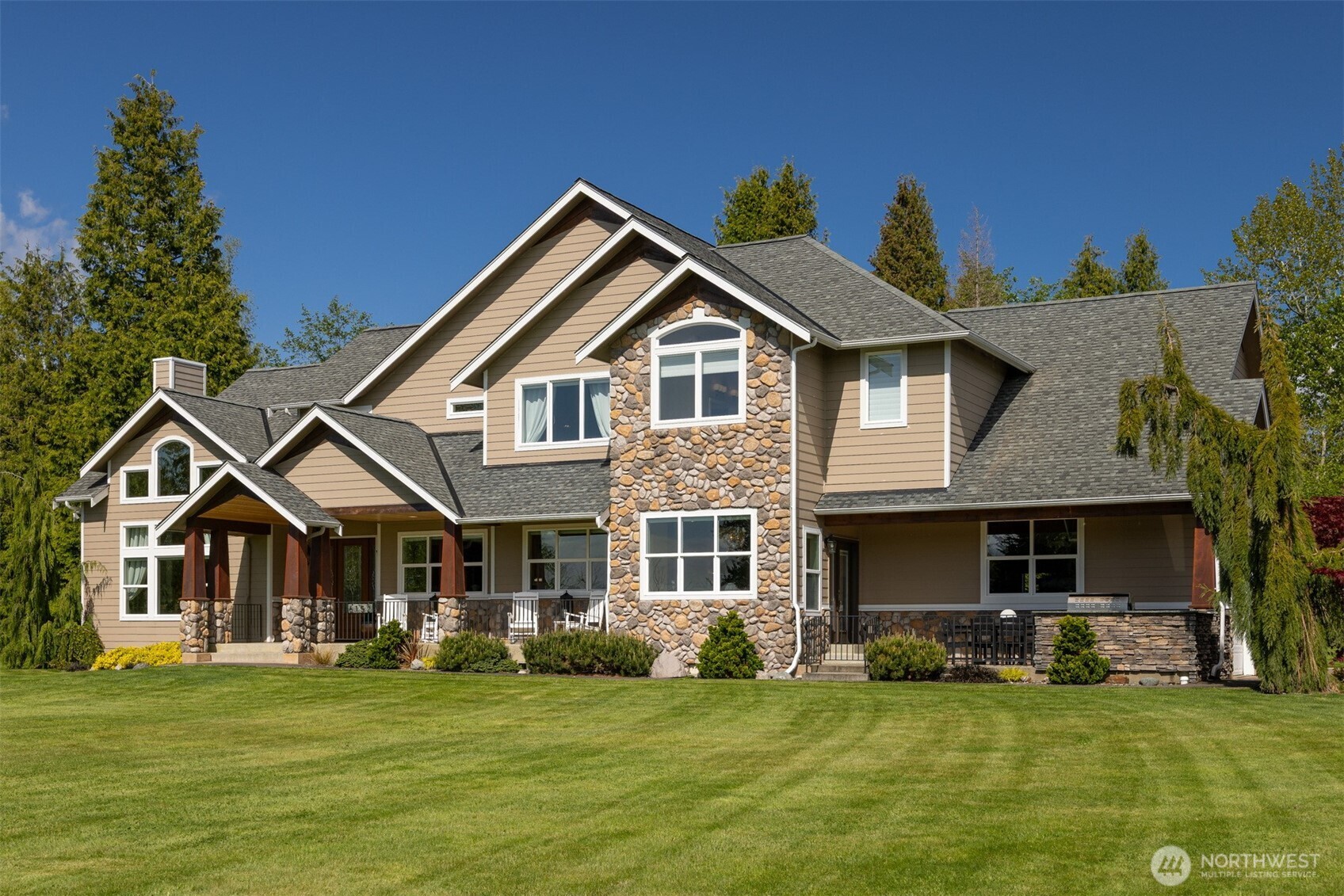 6152 Garrett Lane Ferndale, WA 98248 - Photo 6 of 40 a front view of a house with a garden