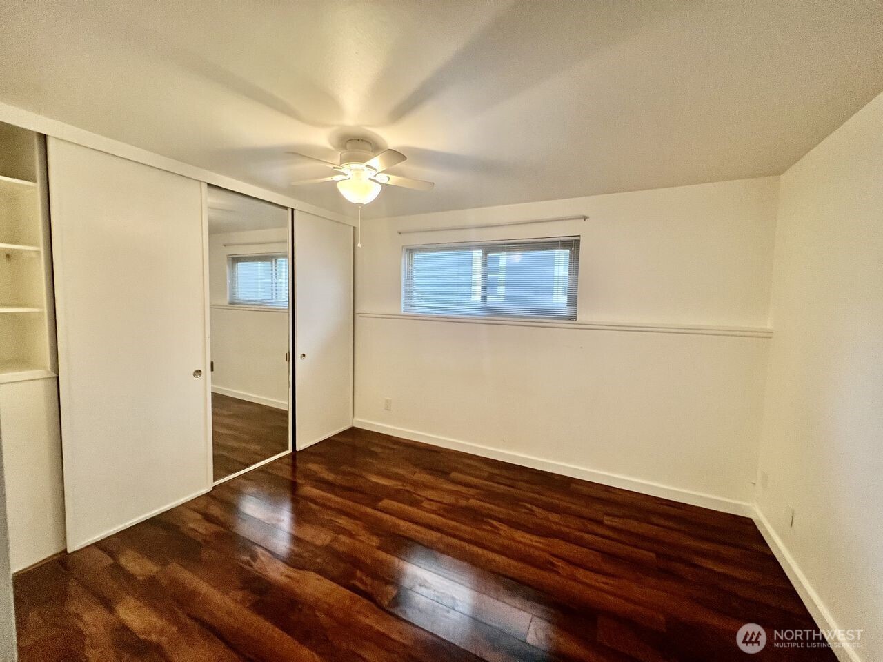 4200 Fremont Avenue North Seattle, WA 98103 - Photo 13 of 17 a view of empty room with wooden floor