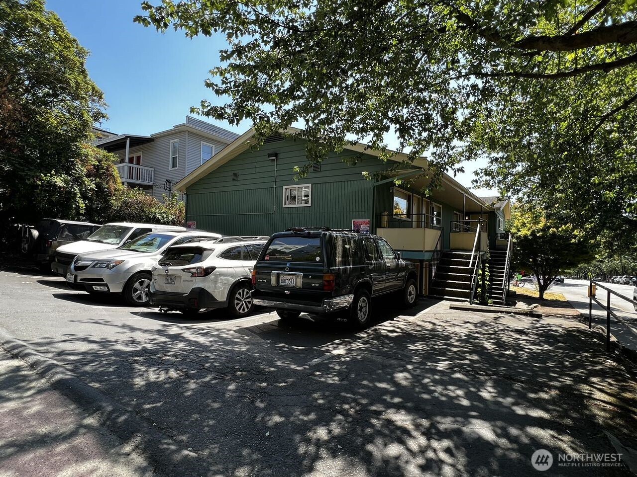 4200 Fremont Avenue North Seattle, WA 98103 - Photo 5 of 17 a car parked in front of a house