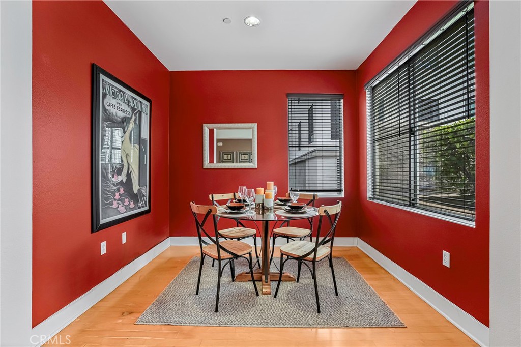 150 The Promenade North, Unit 202 Long Beach, CA 90802 - Photo 11 of 59 a dining room with furniture and window