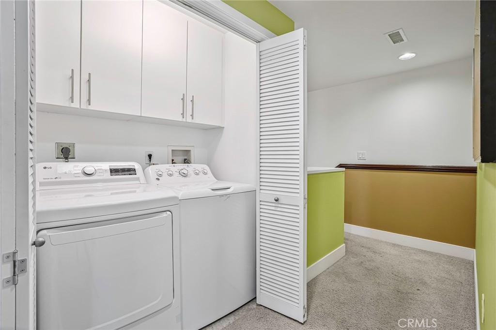 150 The Promenade North, Unit 202 Long Beach, CA 90802 - Photo 16 of 59 a utility room with dryer and washer