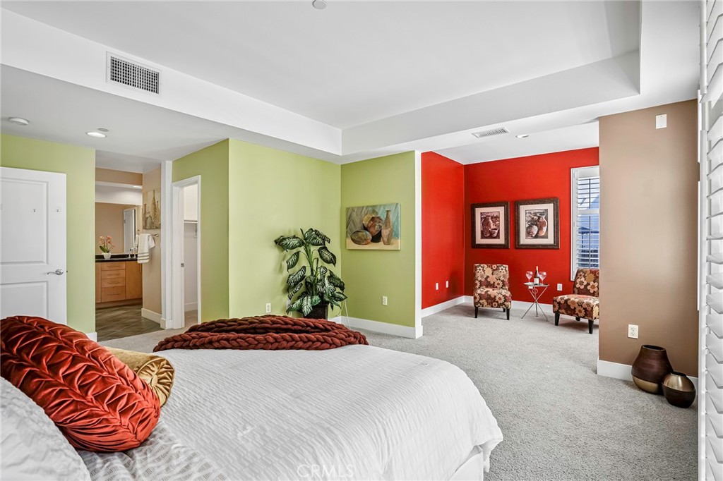 150 The Promenade North, Unit 202 Long Beach, CA 90802 - Photo 27 of 59 a bedroom with a bed and a couch