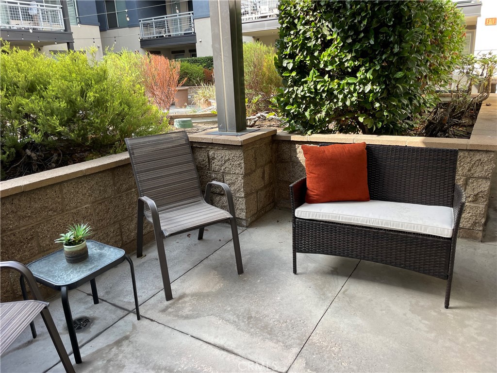 150 The Promenade North, Unit 202 Long Beach, CA 90802 - Photo 31 of 59 a balcony with outdoor seating and plants