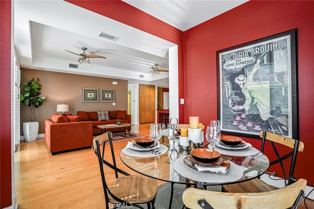 150 The Promenade North, Unit 202 Long Beach, CA 90802 - Photo 10 of 59 a living room with furniture and wooden floor