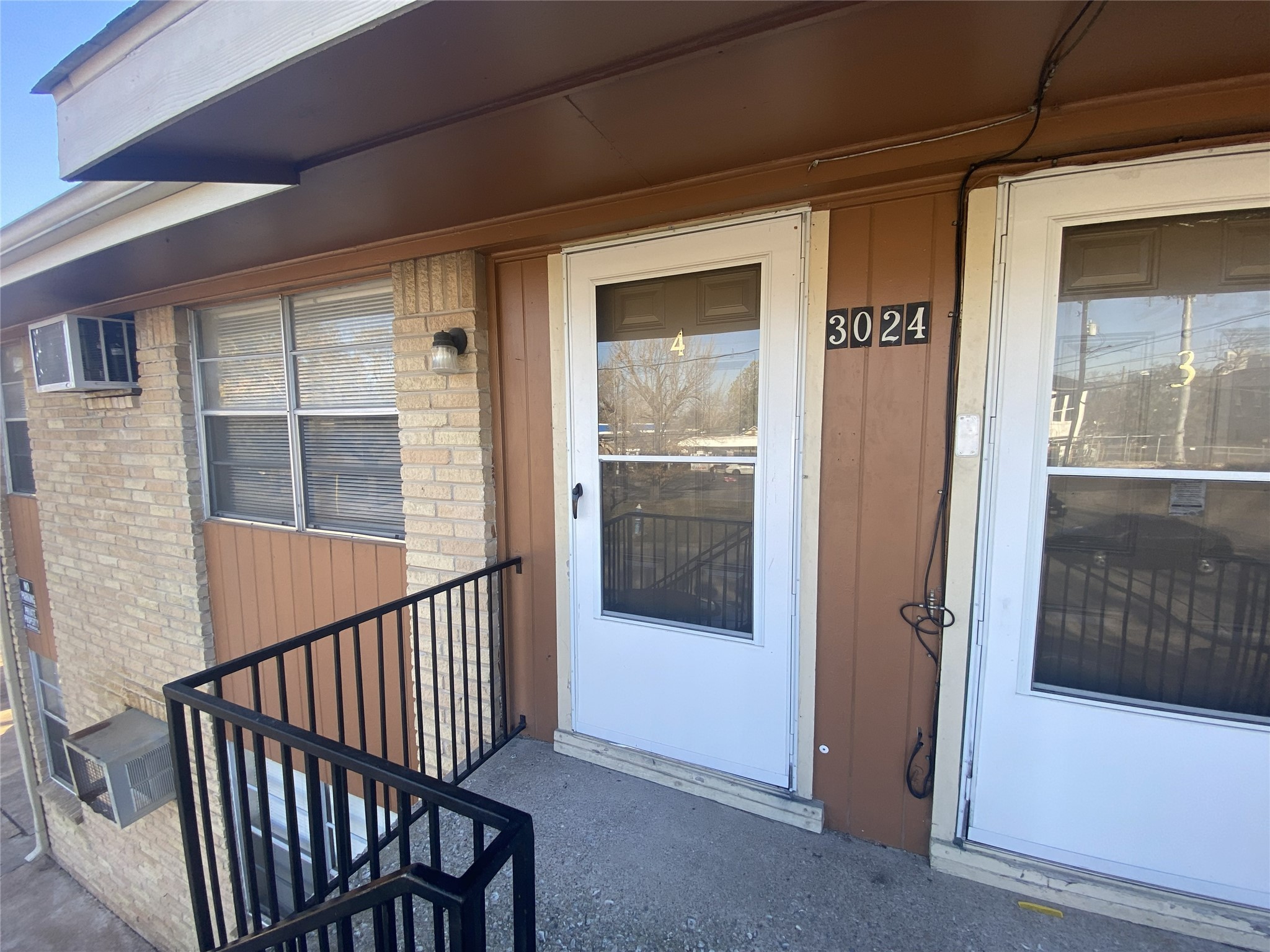3024 Elgin Street, Unit 4 Houston, TX 77004 - Photo 3 of 10 a view of staircase with railing and door