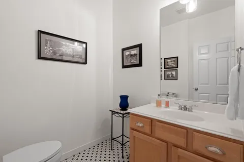 a bedroom with a bed and large windows