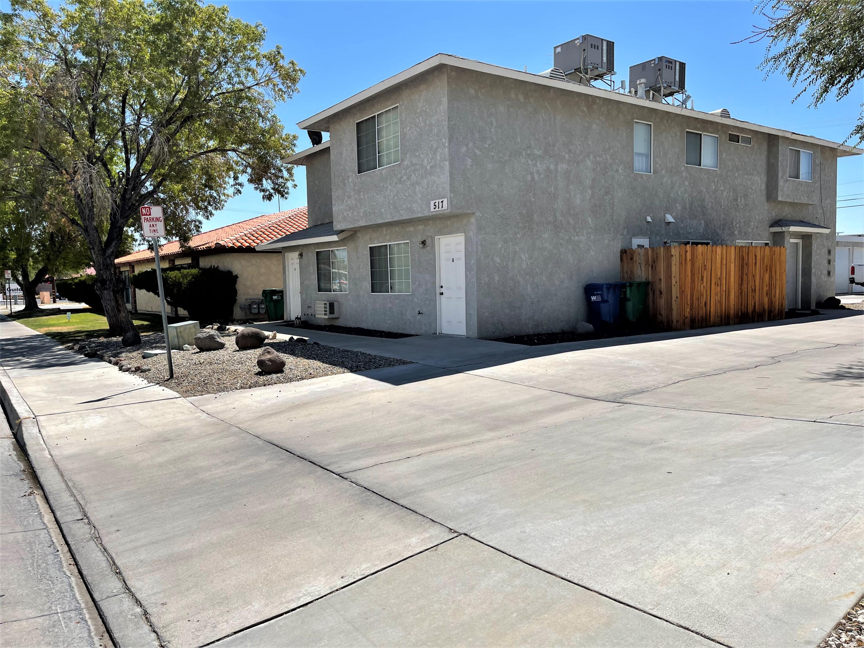 517 West Ward Avenue Ridgecrest, CA 93555 - Photo 1 of 18 a backyard of a house with table and chairs