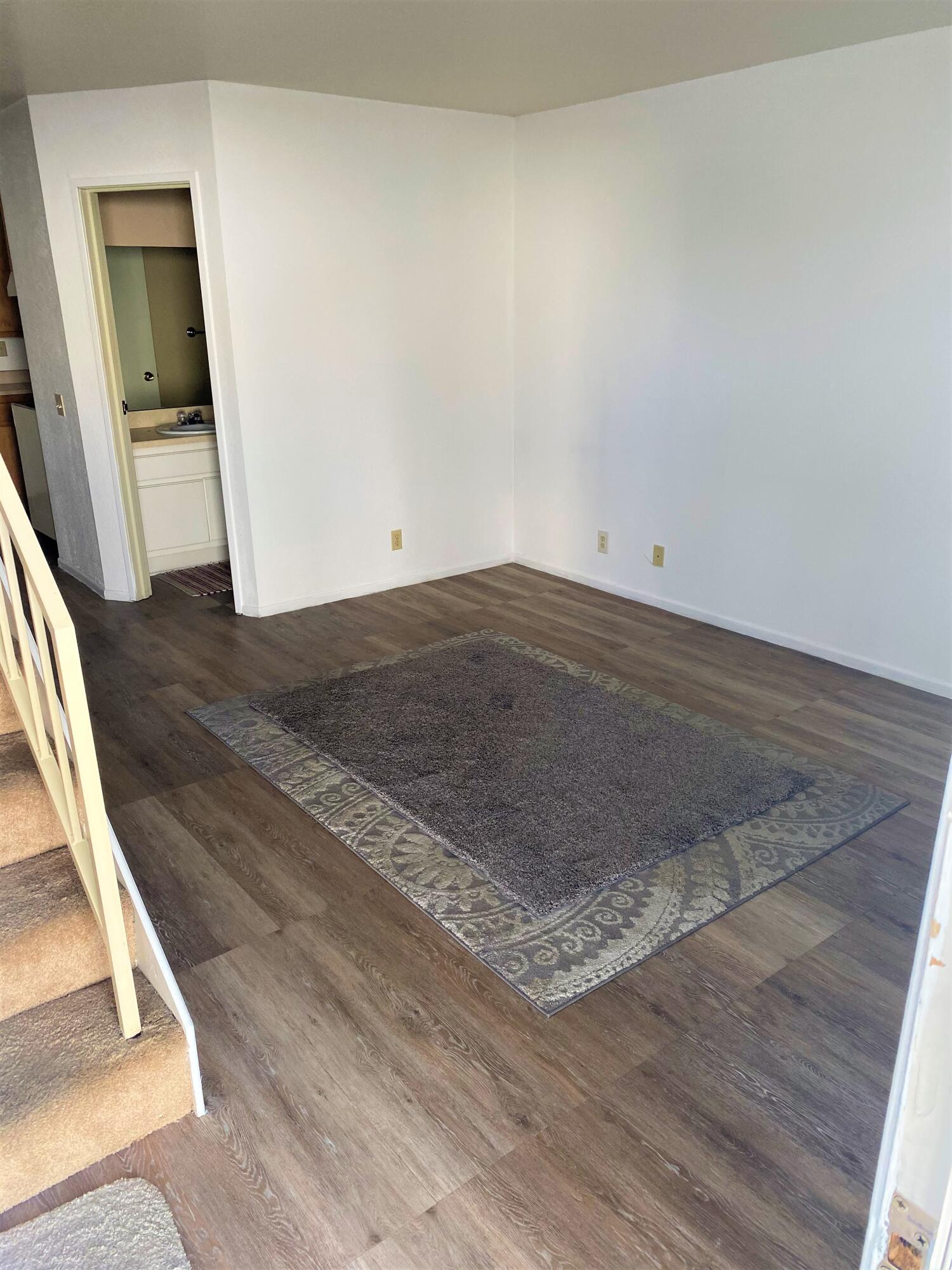 517 West Ward Avenue Ridgecrest, CA 93555 - Photo 4 of 18 an empty room with wooden floor