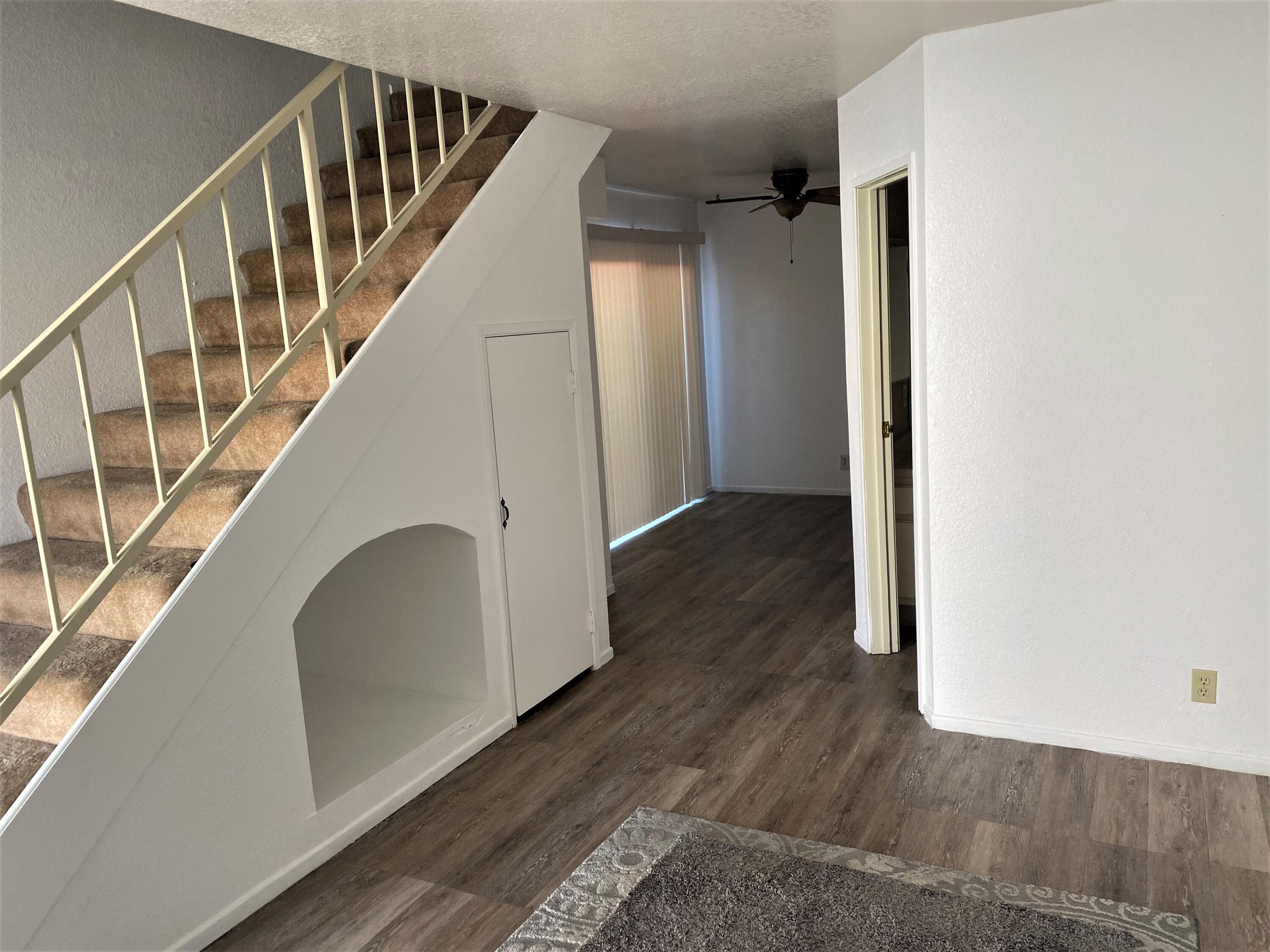 517 West Ward Avenue Ridgecrest, CA 93555 - Photo 5 of 18 a view of staircase with wooden floor and white walls