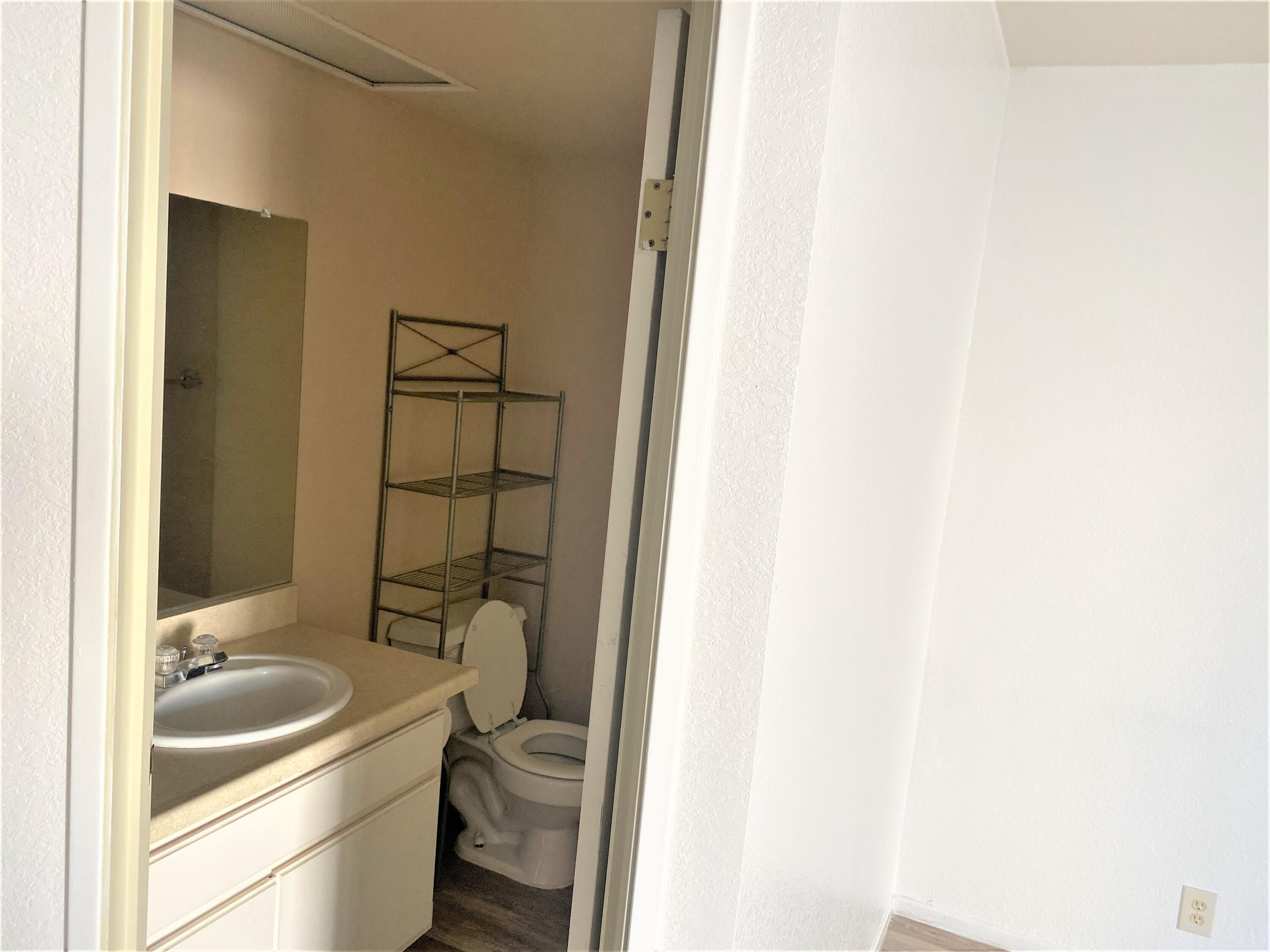 517 West Ward Avenue Ridgecrest, CA 93555 - Photo 7 of 18 a bathroom with a sink and toilet
