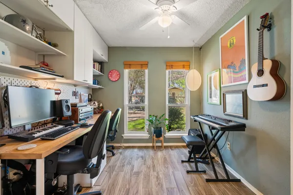 a workspace with furniture and wooden floor