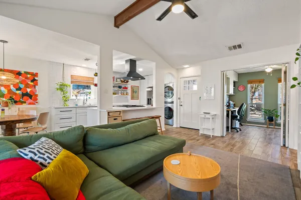a living room with furniture and a table