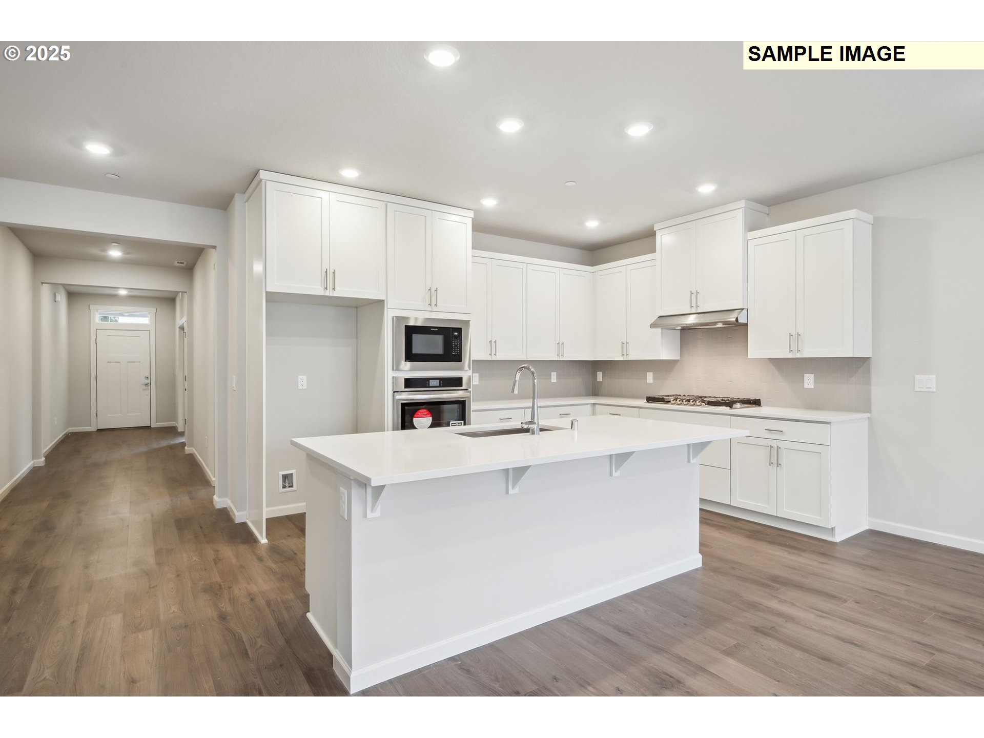 12177 Southwest Champlin Lane Beaverton, OR 97007 - Photo 5 of 22 a open kitchen with stainless steel appliances granite countertop a sink a stove a refrigerator and white cabinets with wooden floor