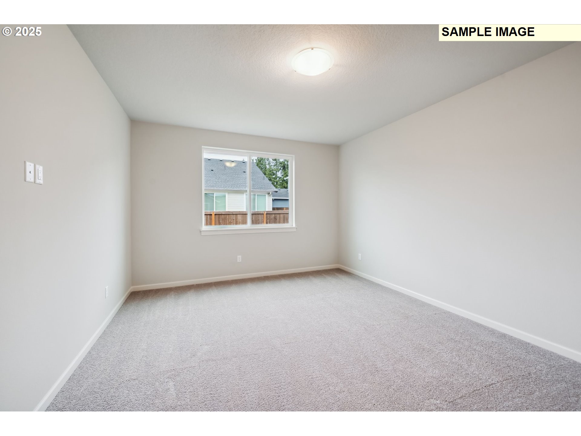 12177 Southwest Champlin Lane Beaverton, OR 97007 - Photo 7 of 22 a view of an empty room with a window