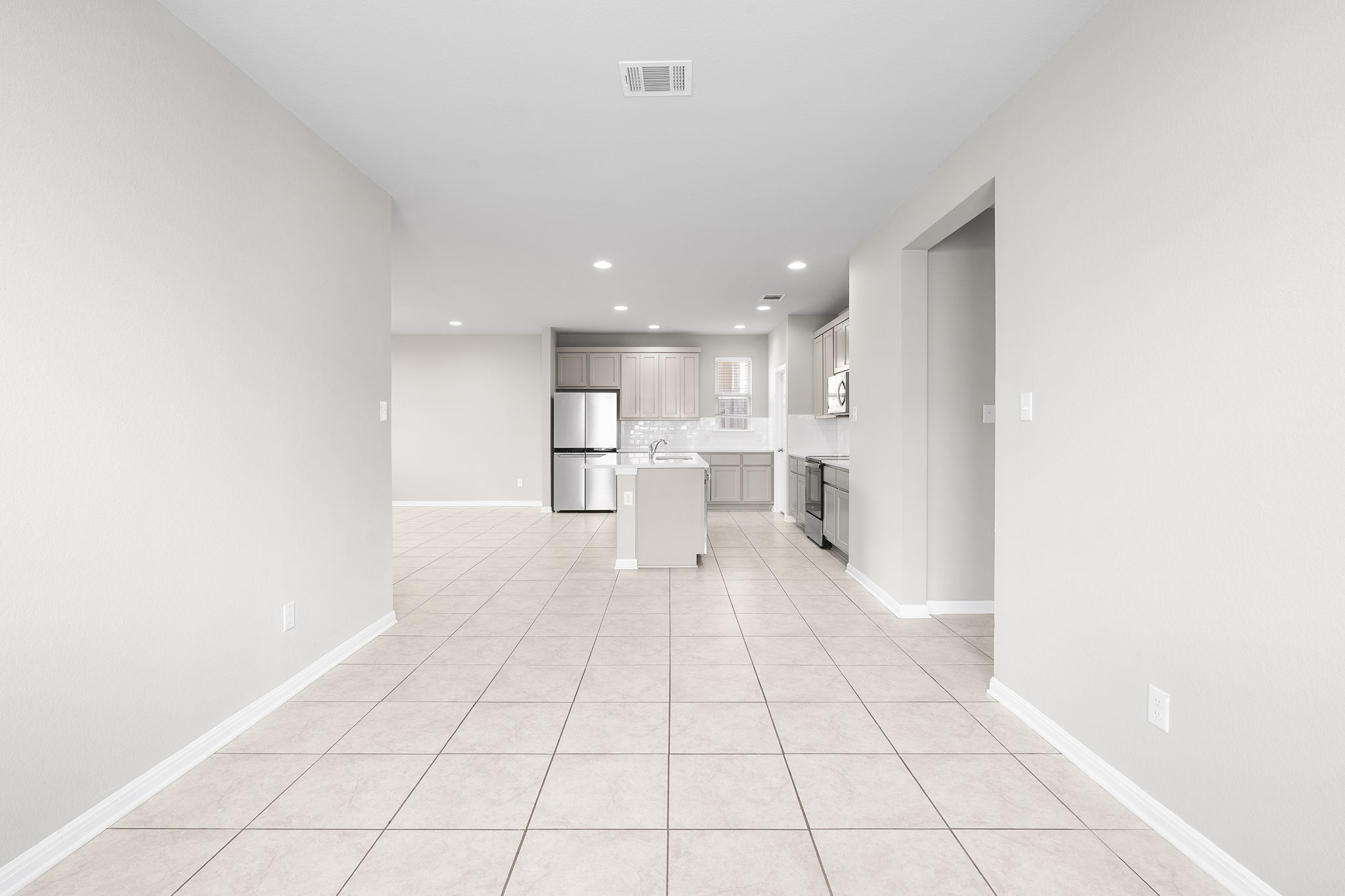 313 Mclintock Road Jarrell, TX 76537 - Photo 40 of 40 An open floorplan seamlessly connects the entry to a well-appointed kitchen.