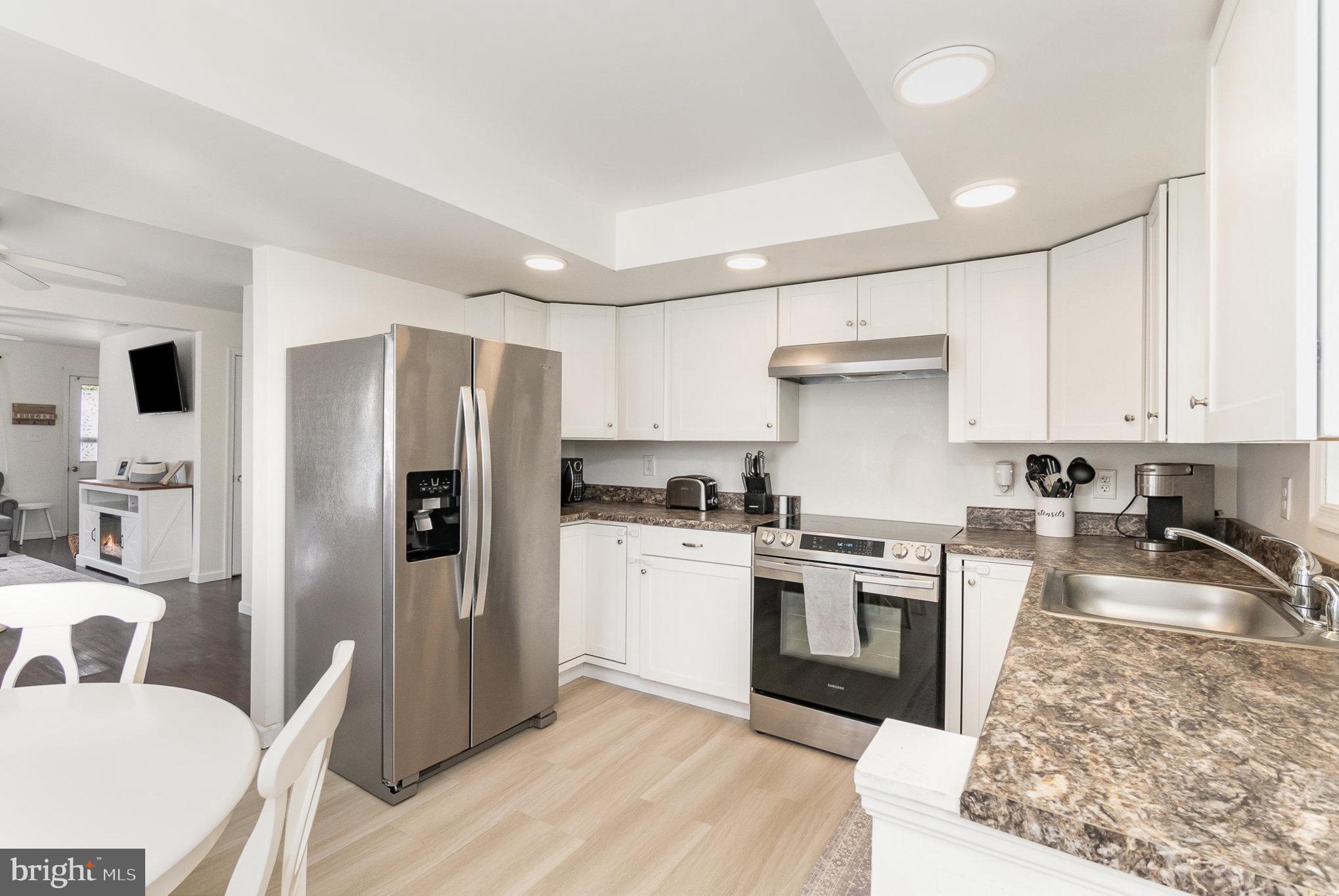 15 Mount Street Rising Sun, MD 21911 - Photo 4 of 30 a kitchen with stainless steel appliances granite countertop a refrigerator stove top oven and sink