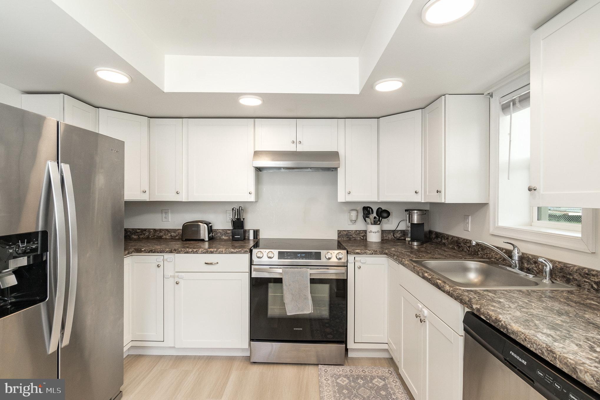 15 Mount Street Rising Sun, MD 21911 - Photo 5 of 30 a kitchen with granite countertop a sink stove and refrigerator