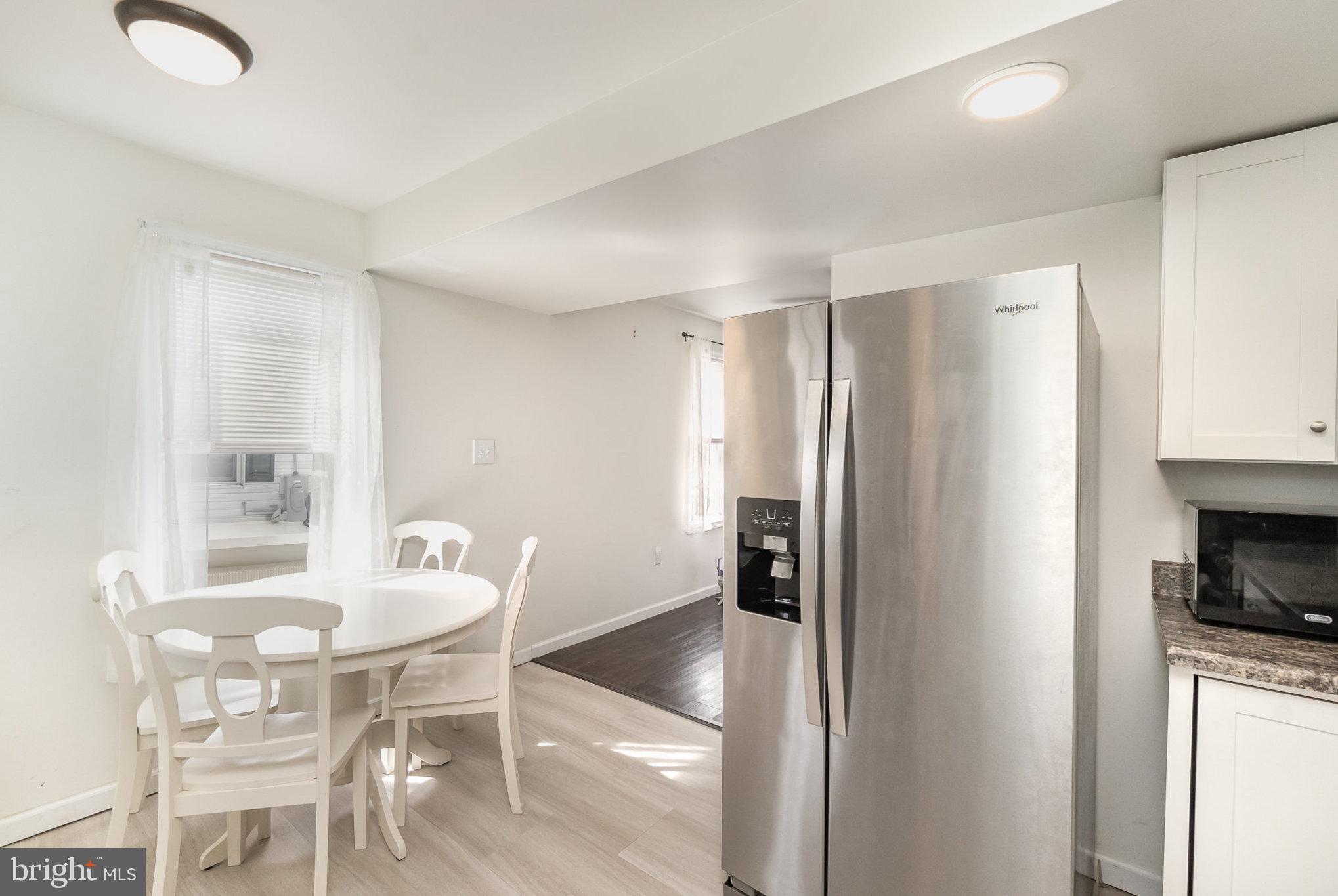15 Mount Street Rising Sun, MD 21911 - Photo 7 of 30 a kitchen with refrigerator and chairs