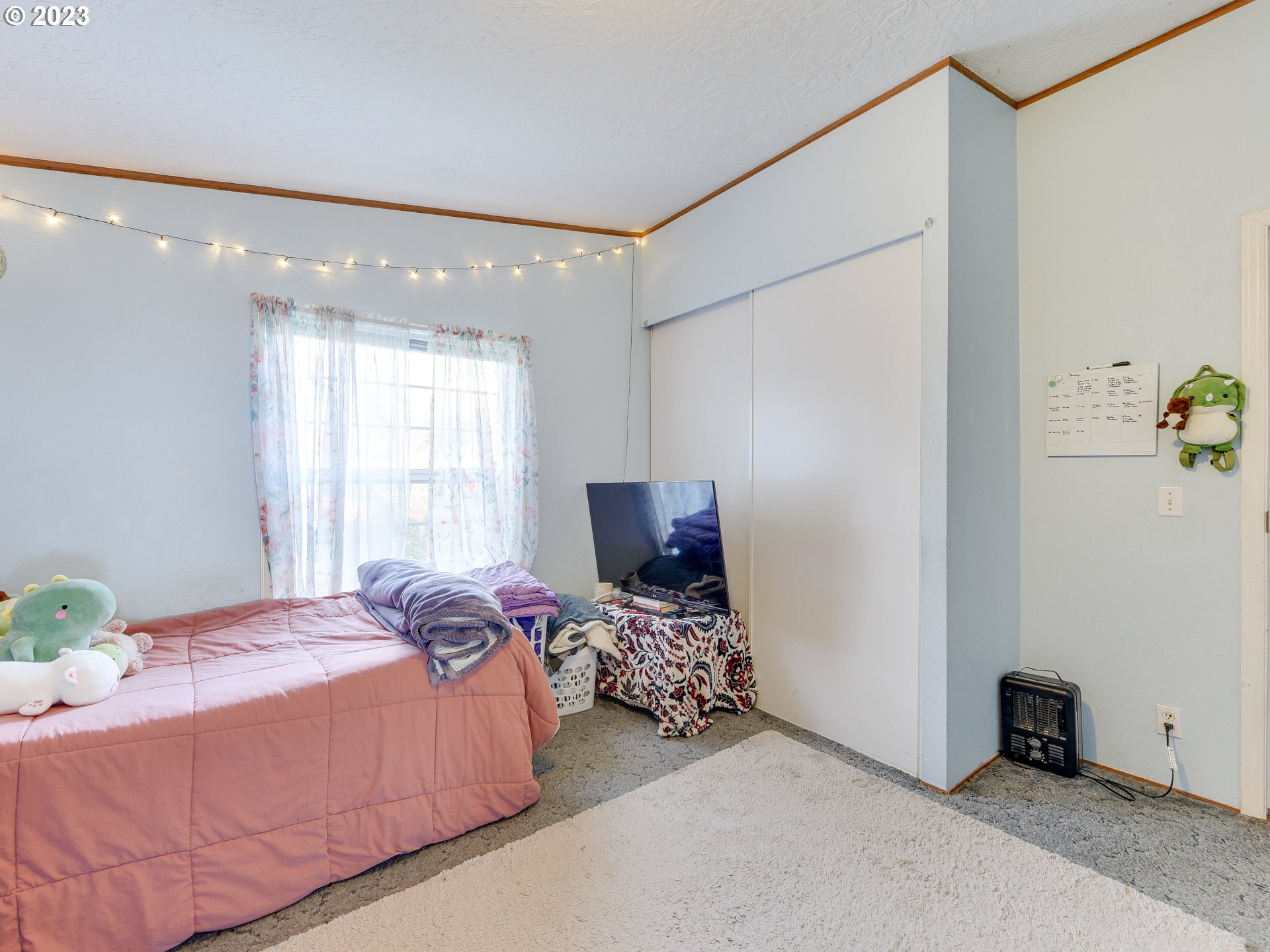 453 Southwest Hawthorn Road Estacada, OR 97023 - Photo 14 of 20 a bedroom with a bed and a window