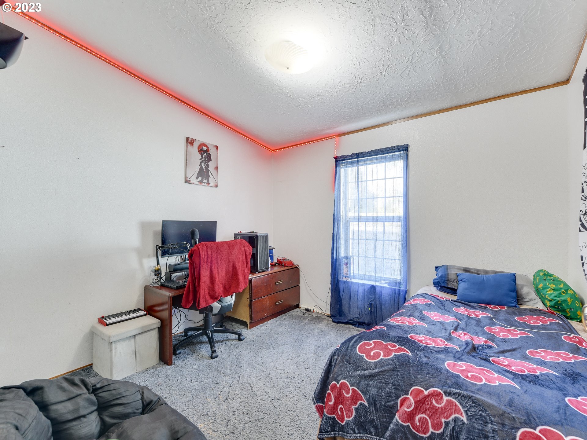 453 Southwest Hawthorn Road Estacada, OR 97023 - Photo 16 of 20 a bedroom with a bed and wooden floor