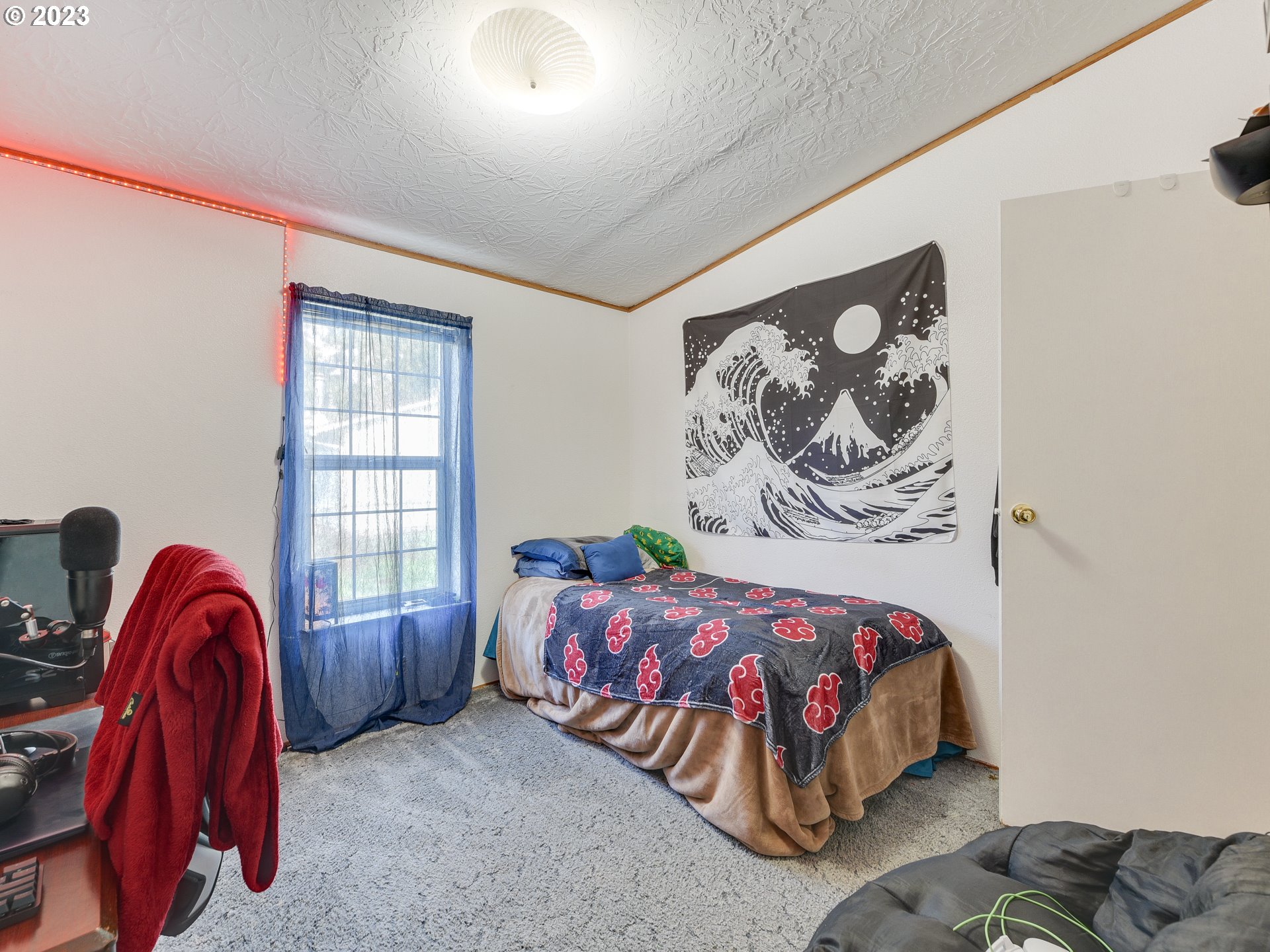 453 Southwest Hawthorn Road Estacada, OR 97023 - Photo 17 of 20 a bedroom with a bed and a window