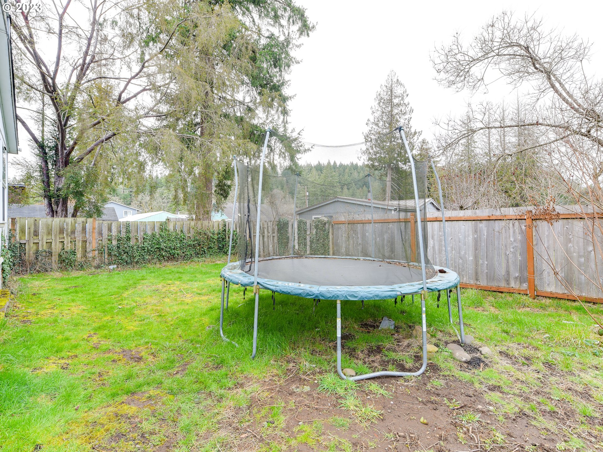 453 Southwest Hawthorn Road Estacada, OR 97023 - Photo 19 of 20 a view of a backyard with table and chairs