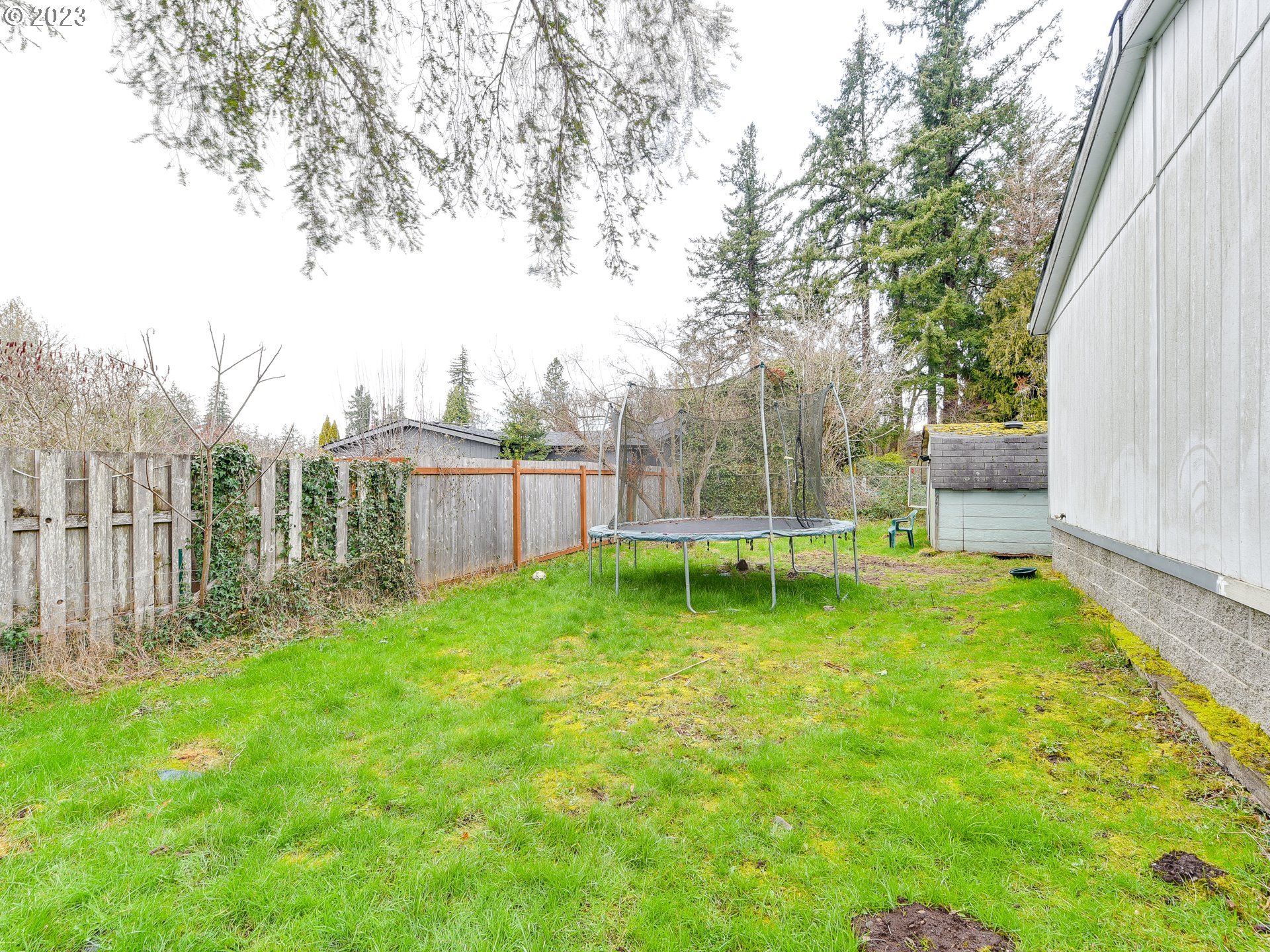 453 Southwest Hawthorn Road Estacada, OR 97023 - Photo 20 of 20 a view of backyard with a garden and deck