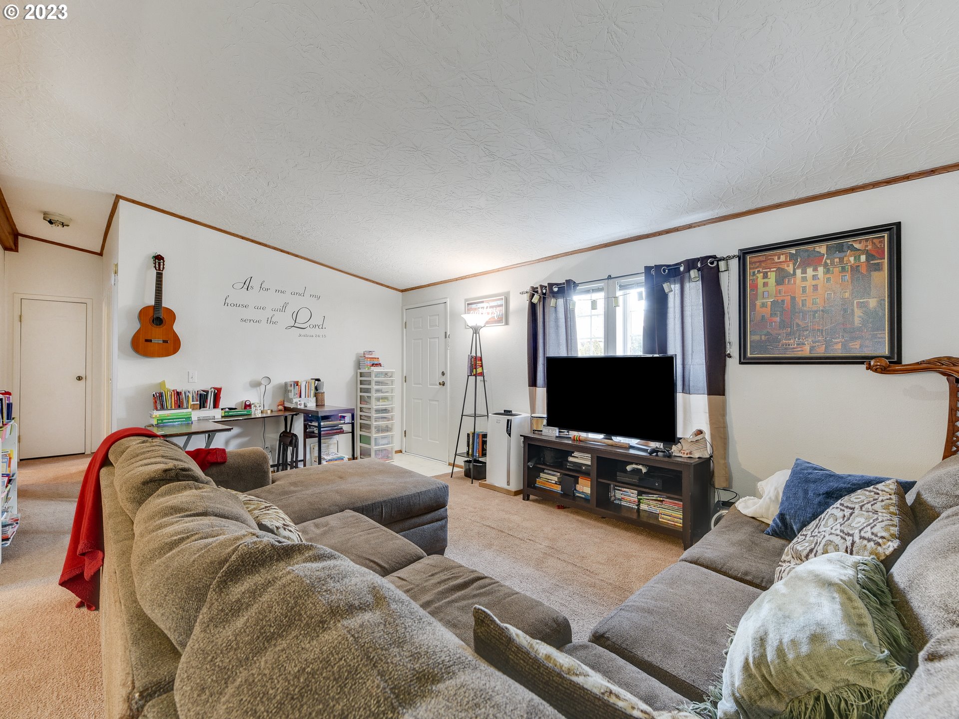 453 Southwest Hawthorn Road Estacada, OR 97023 - Photo 5 of 20 a living room with furniture and a flat screen tv