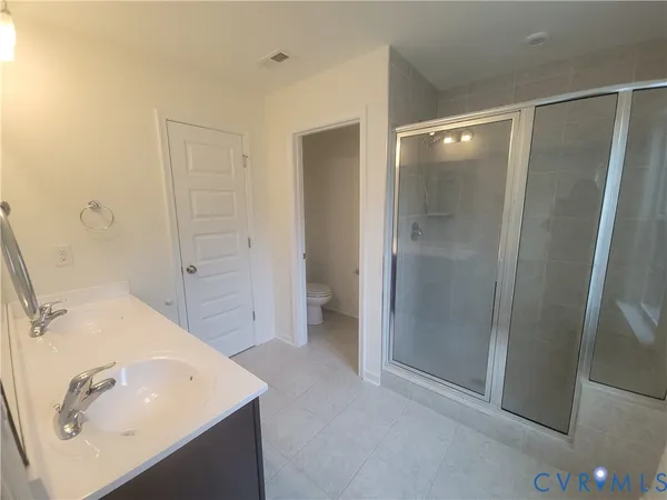 a bathroom with a sink and shower