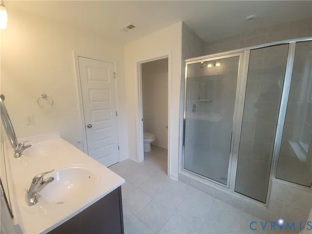 a bathroom with a sink and shower