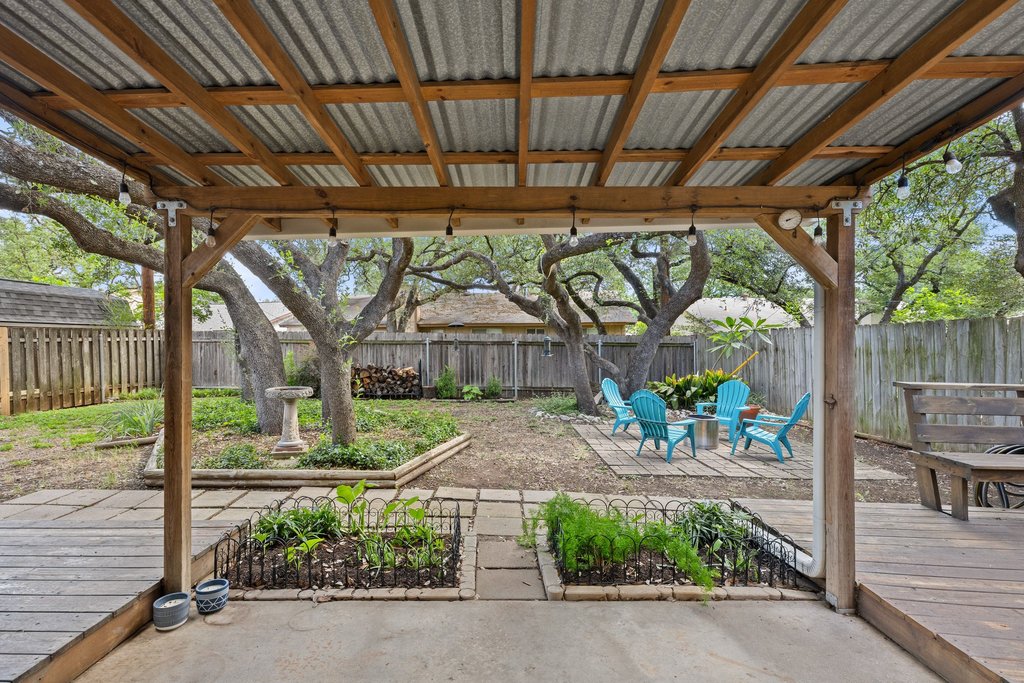 4526 Langtry Lane Austin, TX 78749 - Photo 27 of 33 Backyard covered patio with string lights and tons of seating