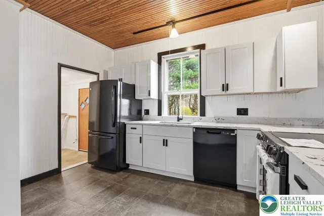 a view of a kitchen with a sink cabinets and a window