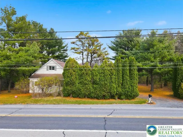 a view of a swimming pool and a yard