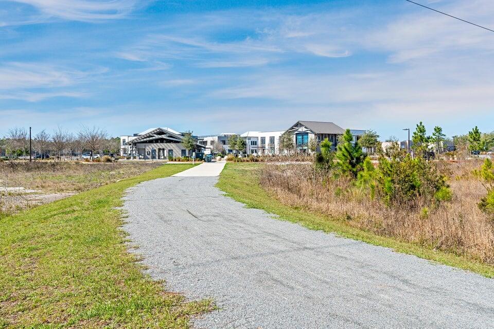 56 Golden Bell Ct Inlet Beach, Unit A Inlet Beach, FL 32461 - Photo 20 of 27 a view of a lake with a big yard