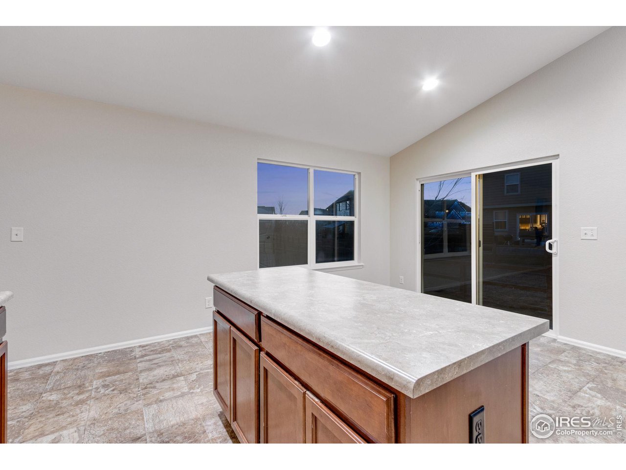1554 Benfleet Court Windsor, CO 80550 - Photo 13 of 26 Kitchen Island with Extra Storage