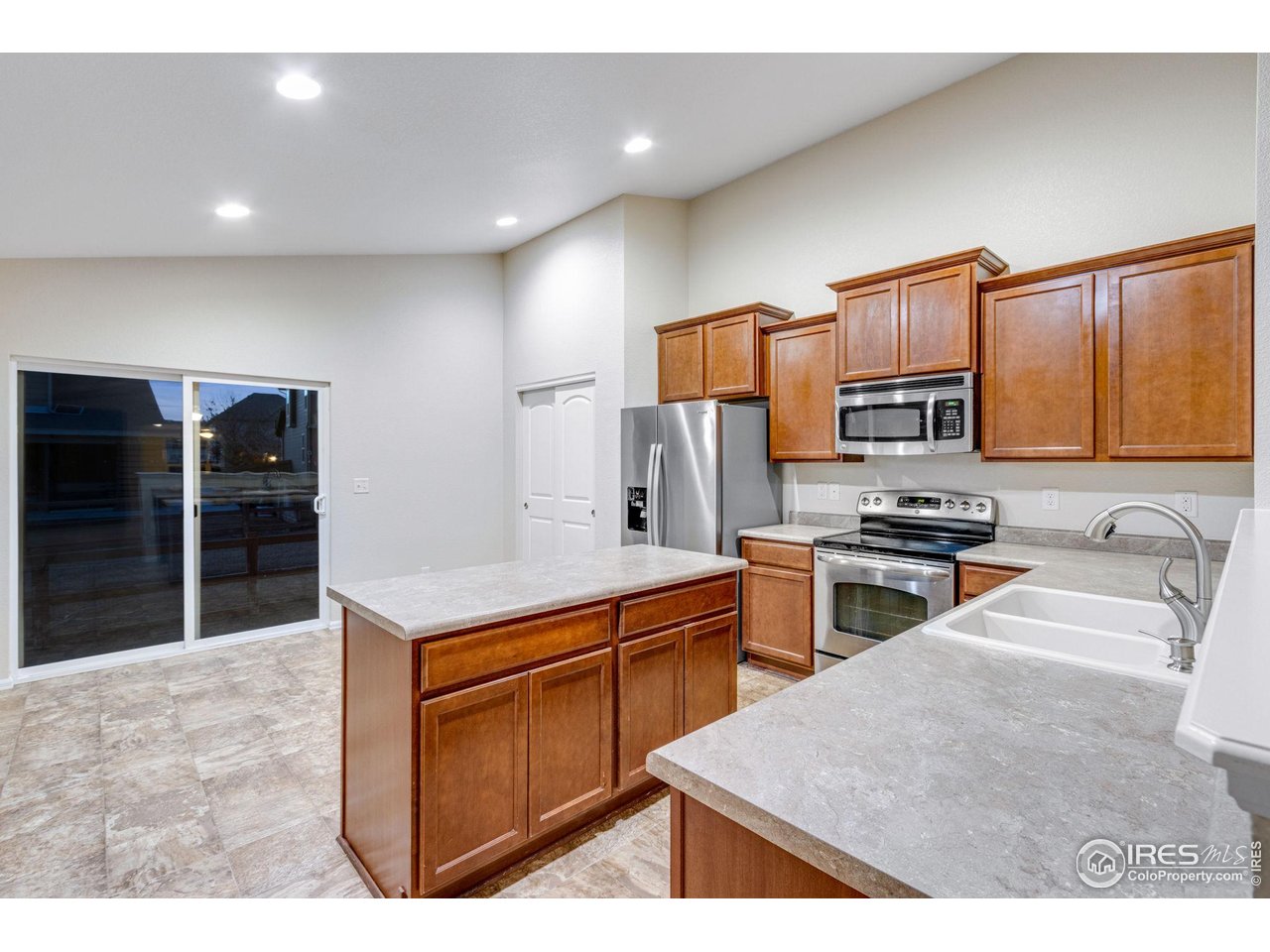 1554 Benfleet Court Windsor, CO 80550 - Photo 15 of 26 Access to Back Patio