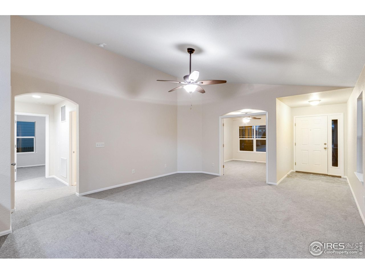 1554 Benfleet Court Windsor, CO 80550 - Photo 6 of 26 Open Living Room with Vaulted Ceilings