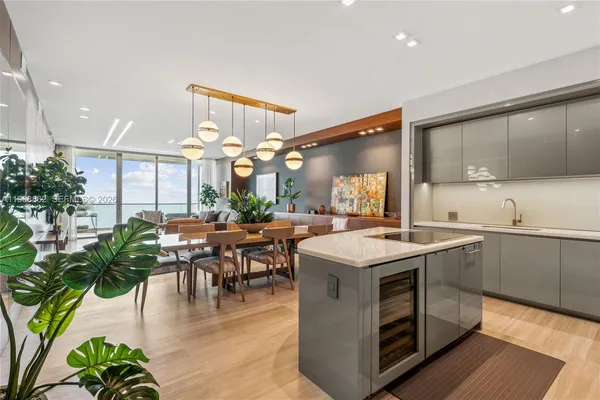 a kitchen with a table and chairs