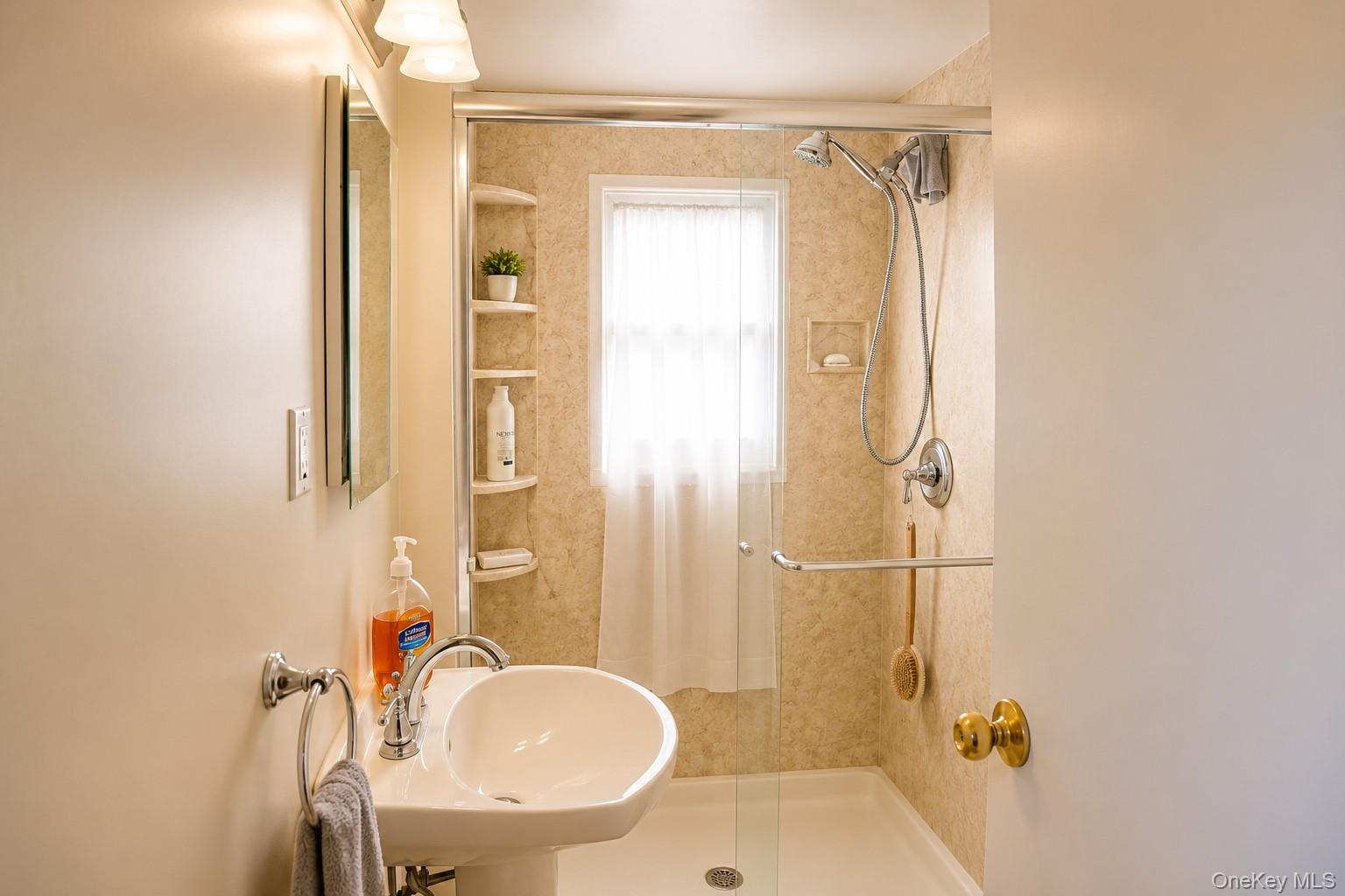 20 Carol Road Bethpage, NY 11714 - Photo 13 of 19 a bathroom with a sink toilet and shower