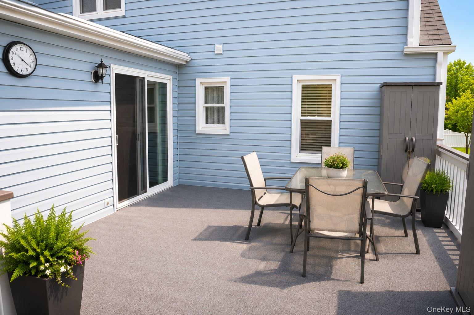 20 Carol Road Bethpage, NY 11714 - Photo 18 of 19 a view of a patio with table and chairs and potted plants