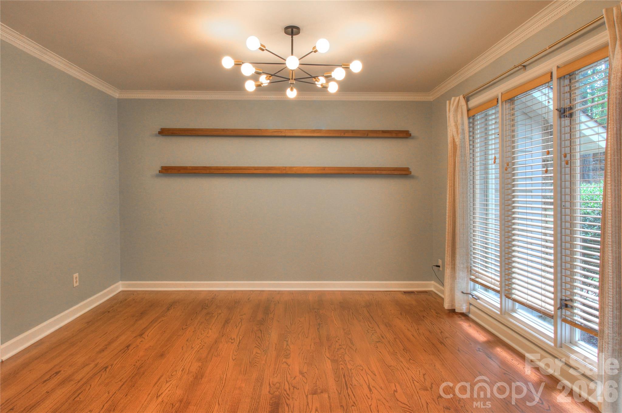 3408 Providence Manor Road Charlotte, NC 28270 - Photo 15 of 39 wooden floor in an empty room with a window