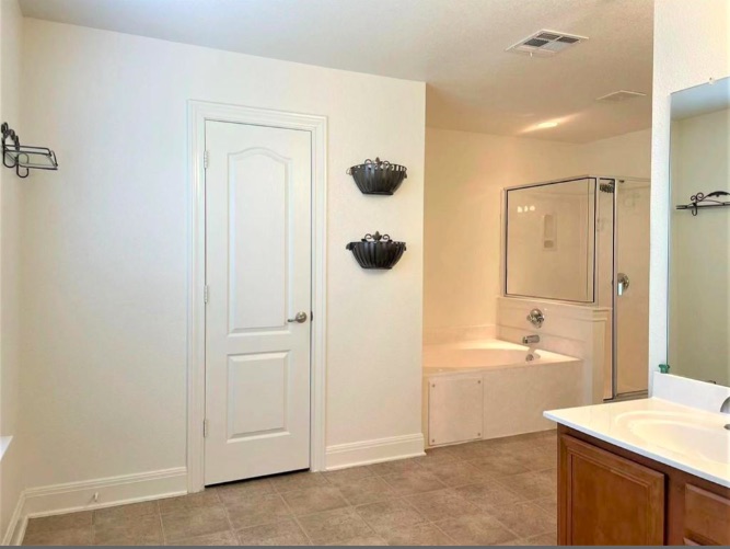 508 Tyree Road Cedar Park, TX 78613 - Photo 19 of 22 a bathroom with a granite countertop sink a toilet a mirror and shower