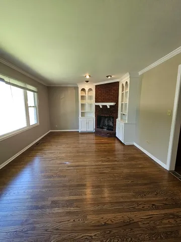 a view of a livingroom with wooden floor