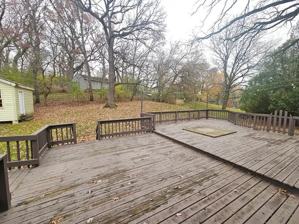 a view of a terrace with trees