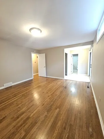 a view of a pathway with a wrought fence