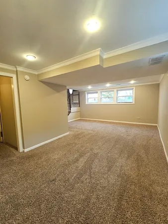 a view of an empty room and a window