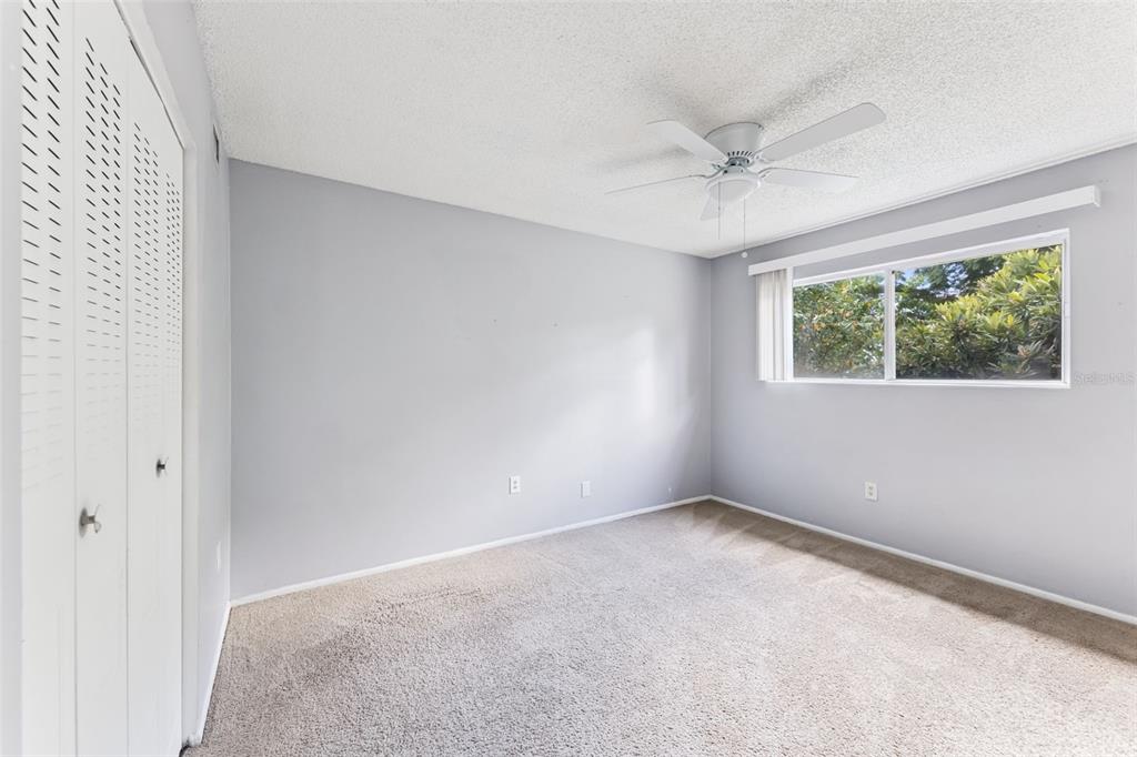 914 Lake Destiny Road, Unit G Altamonte Springs, FL 32714 - Photo 15 of 30 an empty room with windows and ceiling fan