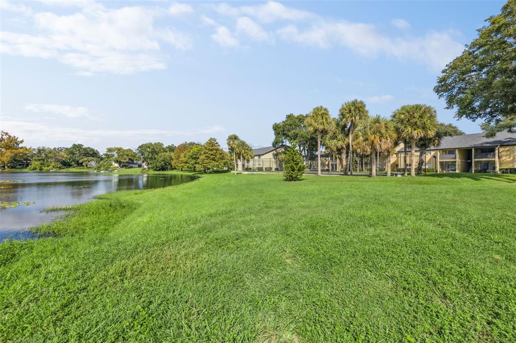 914 Lake Destiny Road, Unit G Altamonte Springs, FL 32714 - Photo 24 of 30 a view of a lake with a house in the background